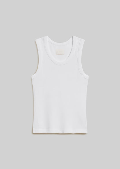 White ribbed knit tank top with a scoop neckline, wide shoulder straps, sleeveless design, and fitted silhouette, front flat lay view on a grey background.
