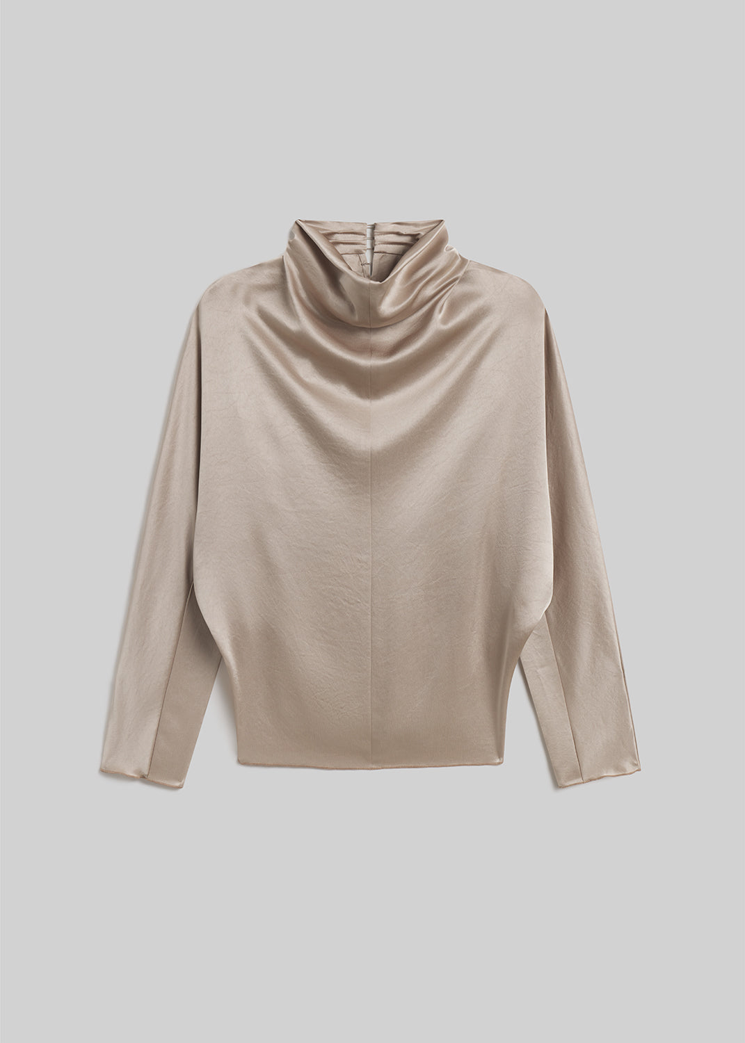 Champagne satin draped mock-neck top on grey background
