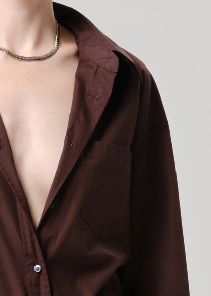 Brown shirt with a deep neckline on a grey background