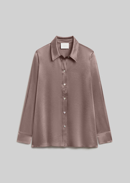 Cocoa brown satin long-sleeve button-down shirt with a pointed collar, front button closure, buttoned cuffs, and a smooth, lustrous finish, front flat lay view on a grey background.