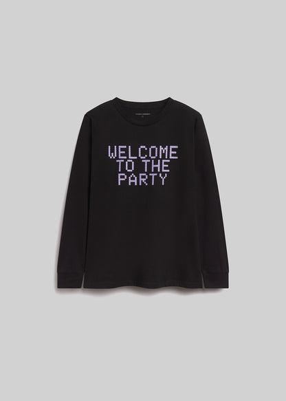Black long-sleeve shirt with 'Welcome to the Party' text on a light gray background
