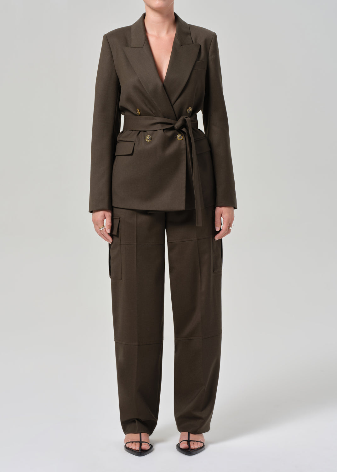 Brown suit with a belt on a white background
