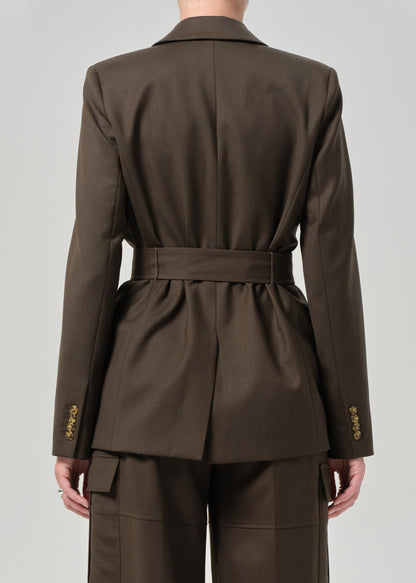 Brown suit with a belt on a plain background