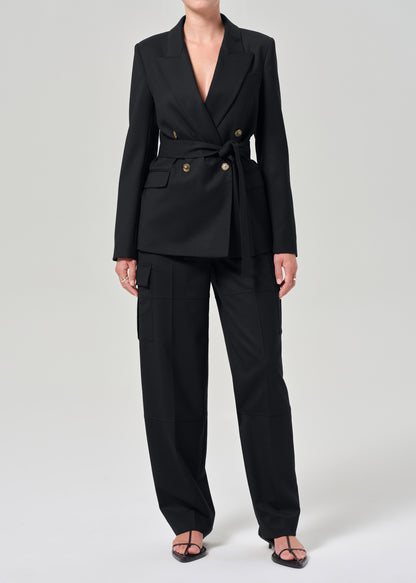 Black suit with gold buttons on a grey background