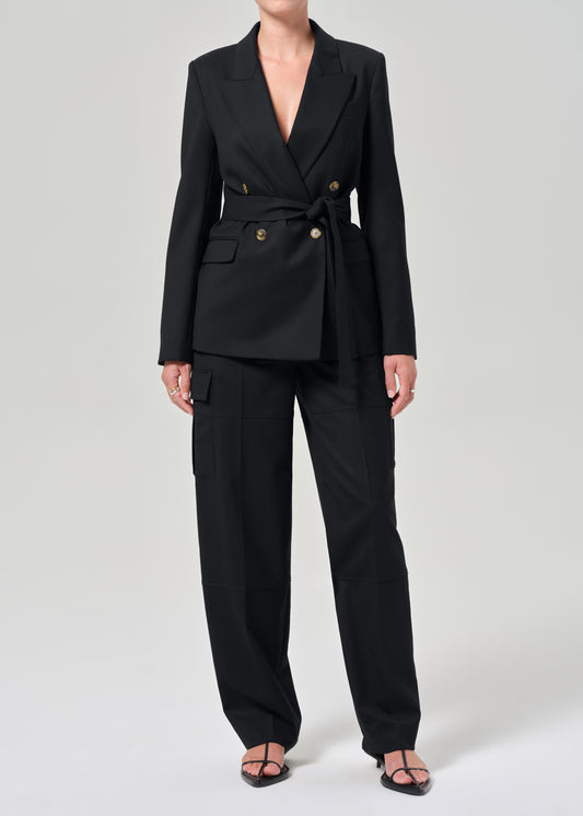 Black suit with gold buttons on a grey background