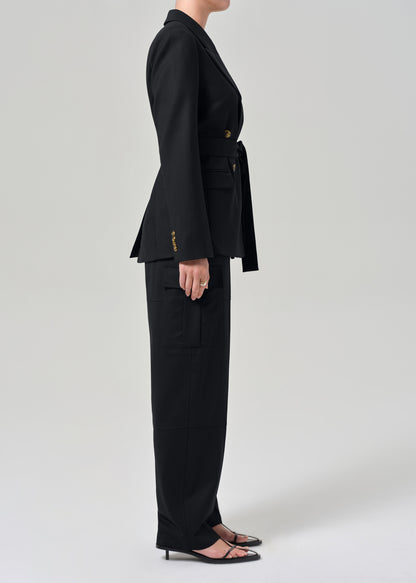 Black suit with gold buttons on a grey background