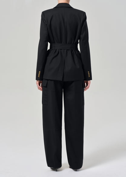 Black suit with gold buttons on a grey background