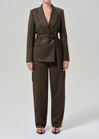 Brown suit with a belt on a grey background