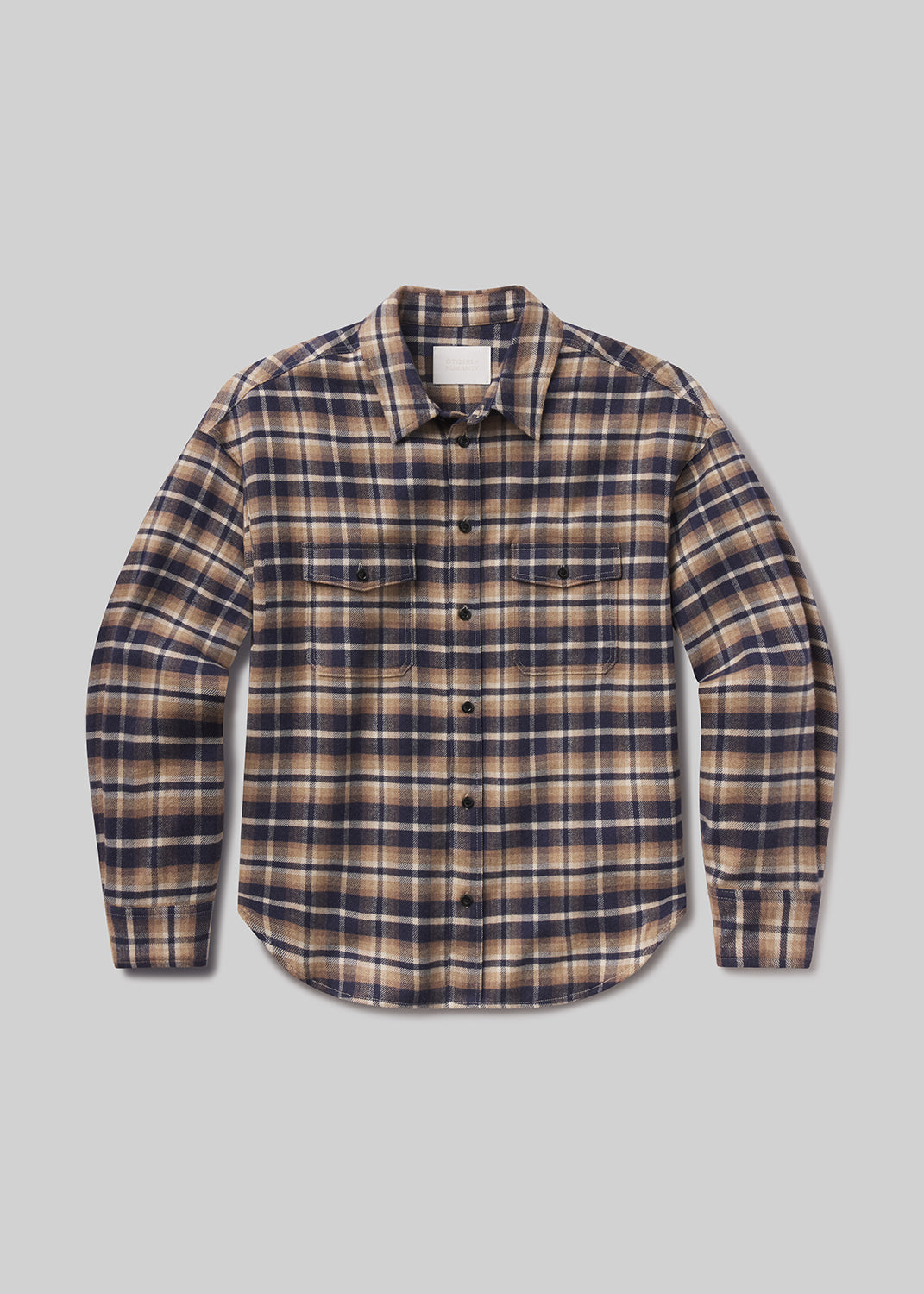 Flat lay of plaid shirt on a grey background