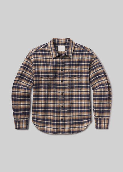 Flat lay of plaid shirt on a grey background