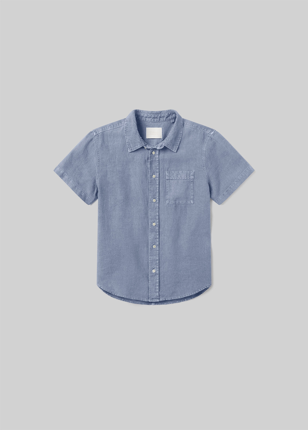 Stone blue short sleeve button-up shirt with a pointed collar, front button closure, and single chest pocket, front flat lay view on a grey background.