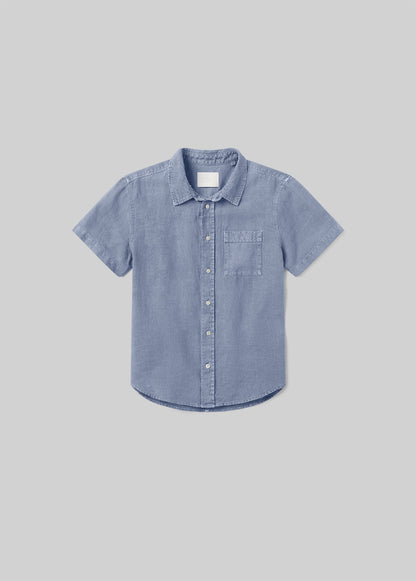 Stone blue short sleeve button-up shirt with a pointed collar, front button closure, and single chest pocket, front flat lay view on a grey background.