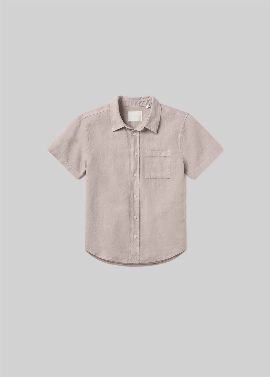 Wheat beige short sleeve button-up shirt with a pointed collar, front button closure, and single chest pocket, front flat lay view on a grey background.