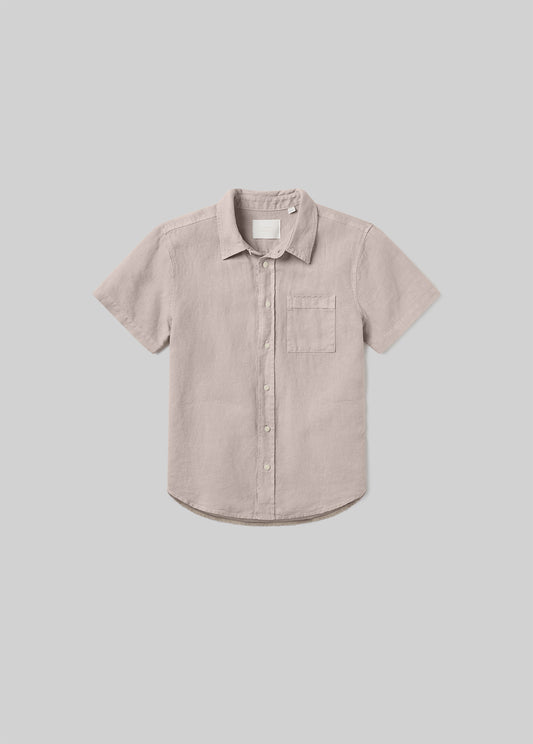Wheat beige short sleeve button-up shirt with a pointed collar, front button closure, and single chest pocket, front flat lay view on a grey background.