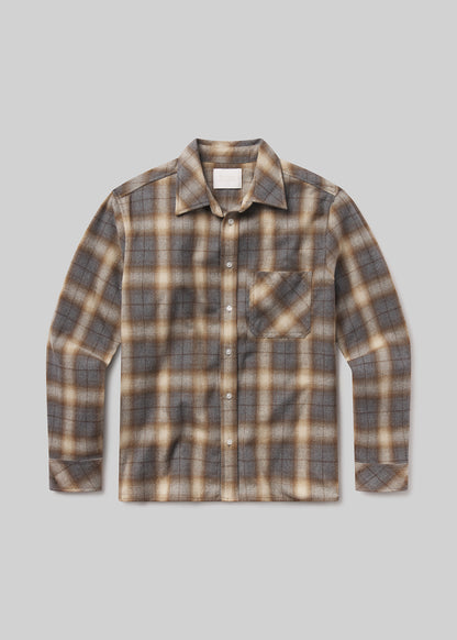Plaid shirt with brown and beige pattern on a grey background