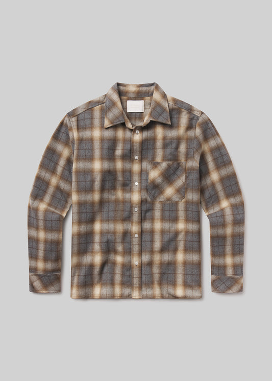 Plaid shirt with brown and beige pattern on a grey background