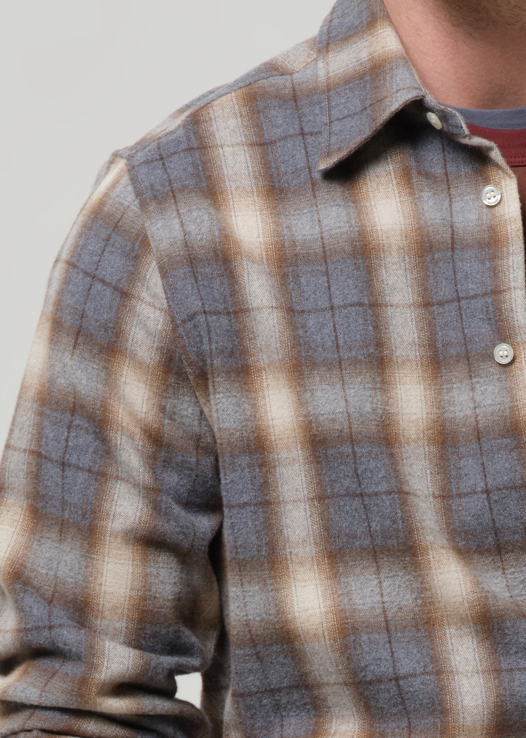 Plaid shirt with a focus on the pattern and fabric texture.