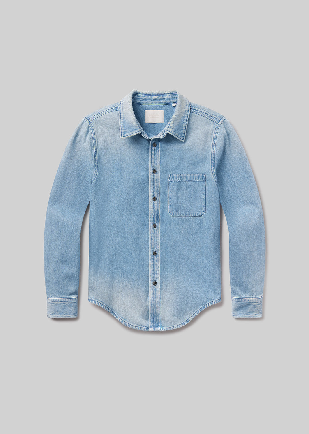Light blue long sleeve denim button-up shirt with a pointed collar, front button closure, single chest pocket