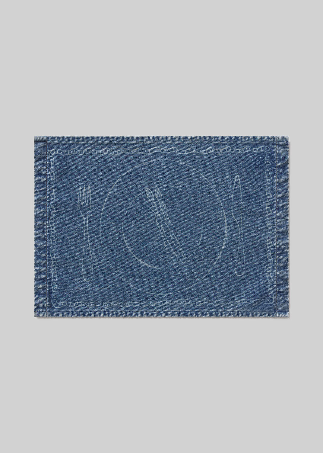 Denim placemat with asparagus, cutlery and plate design on a light gray background