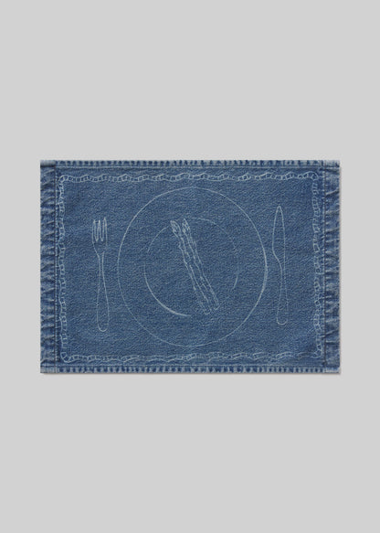 Denim placemat with asparagus, cutlery and plate design on a light gray background