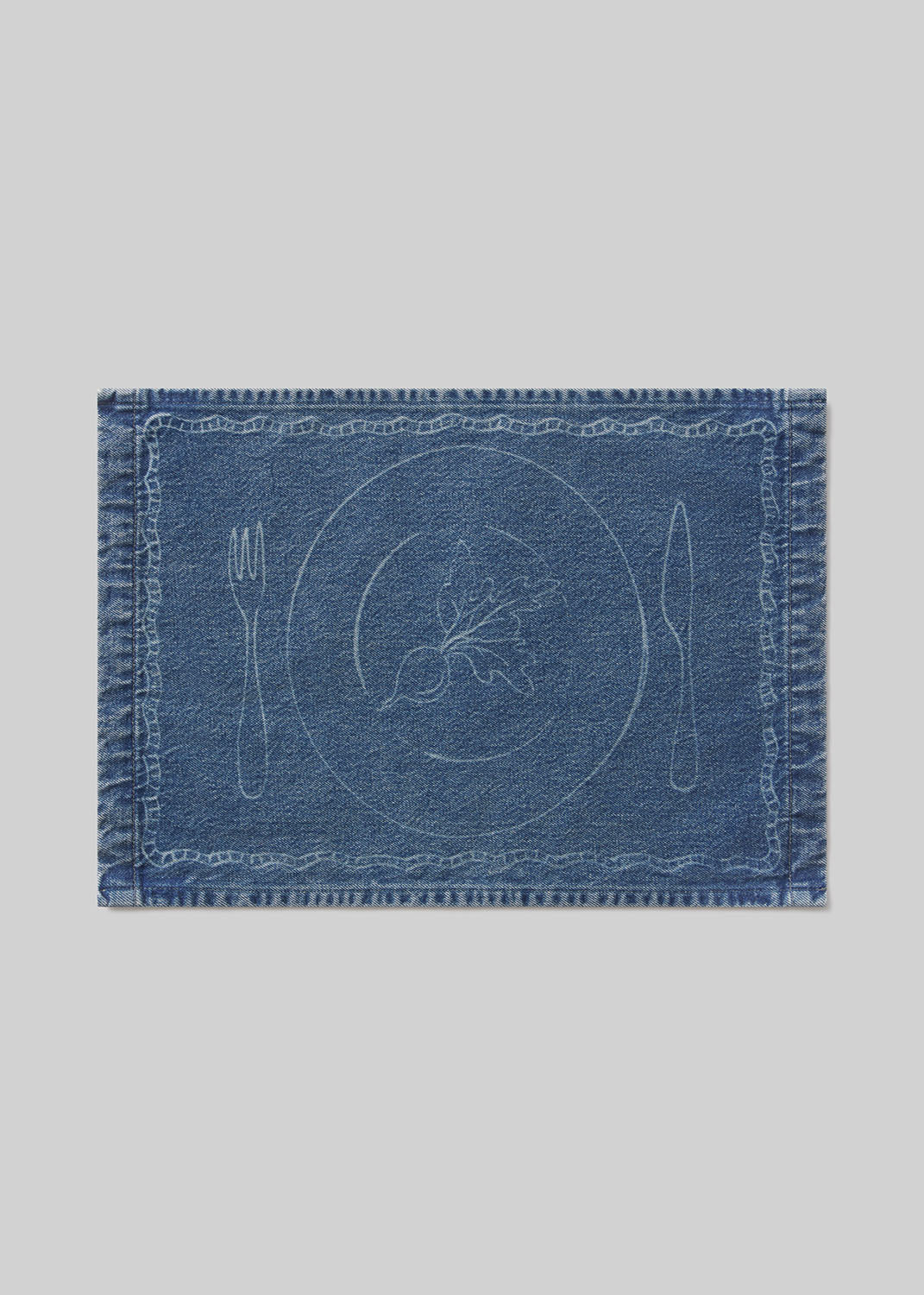 Blue denim placemat with beet design on a light gray background