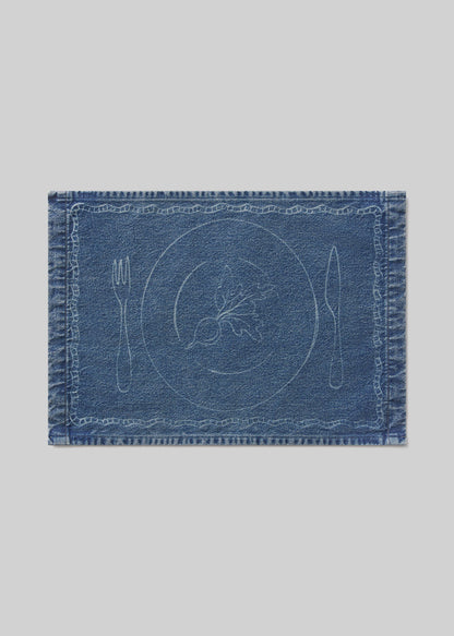 Blue denim placemat with beet design on a light gray background