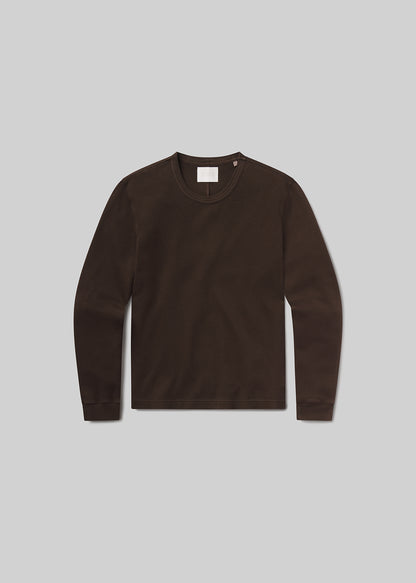 Flat shot of brown long-sleeve shirt on a grey background