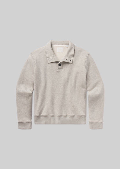 Flat shot of grey sweater with collar on a gray background