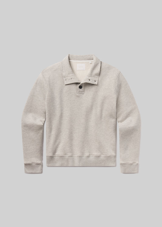 Flat shot of grey sweater with collar on a gray background