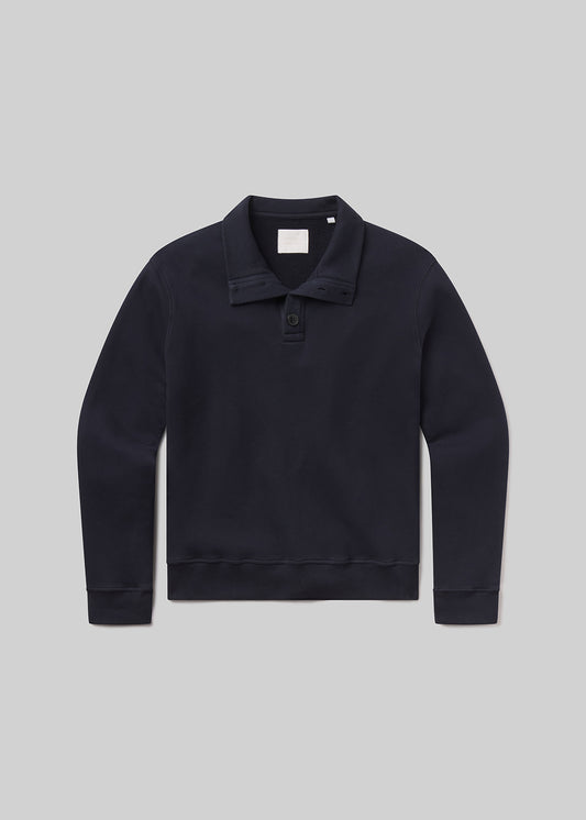 Flat shot of black sweater with collar on a grey background