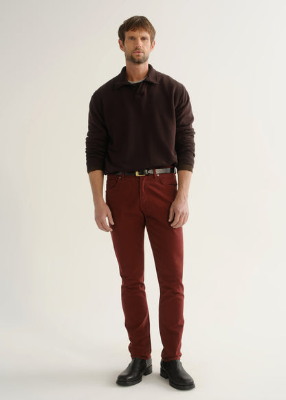 Person wearing dark brown rugby pullover and burgundy pants front